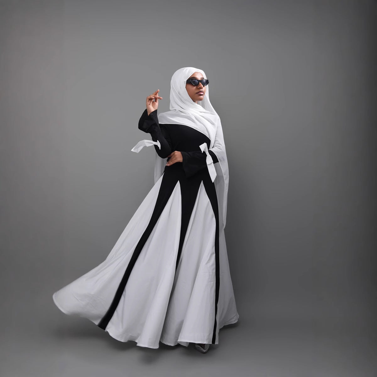 This abaya redefines modern modest fashion with its sleek design and elegant flow.