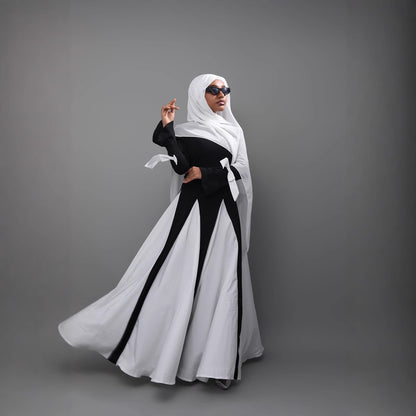 This abaya redefines modern modest fashion with its sleek design and elegant flow.