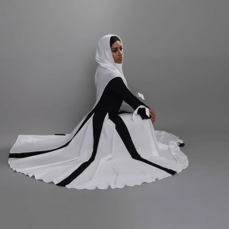 This abaya redefines modern modest fashion with its sleek design and elegant flow.
