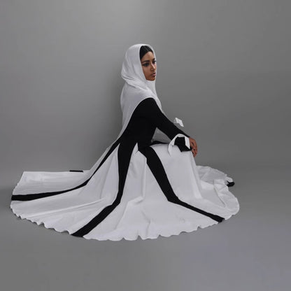 This abaya redefines modern modest fashion with its sleek design and elegant flow.