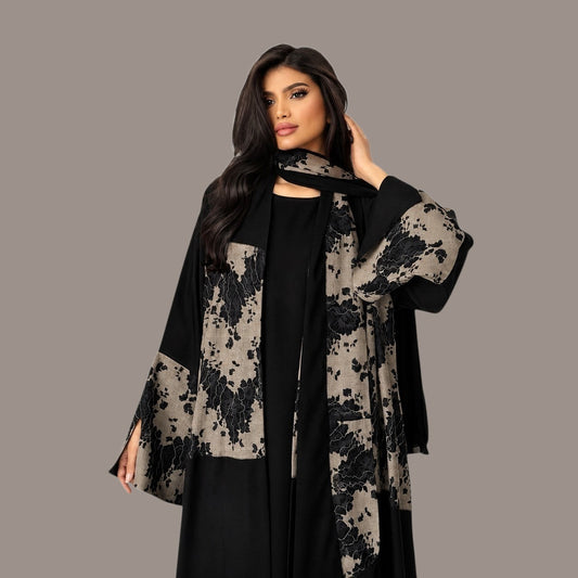 Anab Abaya 2-piece set featuring a black long dress and a matching scarf with elegant contrasting floral patterns.