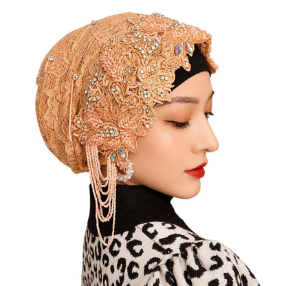 Anab Abaya peach lace hijab featuring intricate floral embroidery, crystal embellishments, and hanging pearl details.