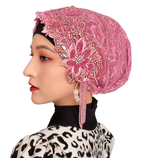 Anab Abaya pink lace hijab featuring intricate floral embroidery, sparkling crystal embellishments, and pearl dangles.